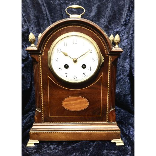 An Edwardian Mahogany Mantel Clock