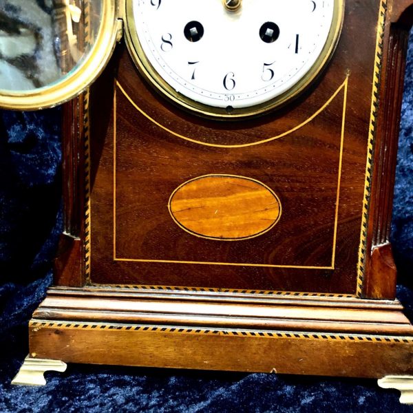 An Edwardian Mahogany Mantel Clock