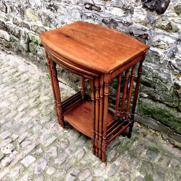 An Edwardian Nest Of Four Mahogany Side Tables