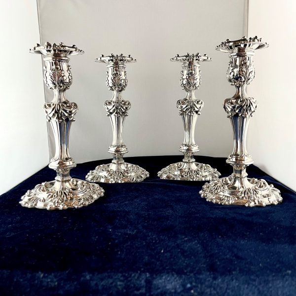 A Set of Four Old Sheffield Plate Candlesticks