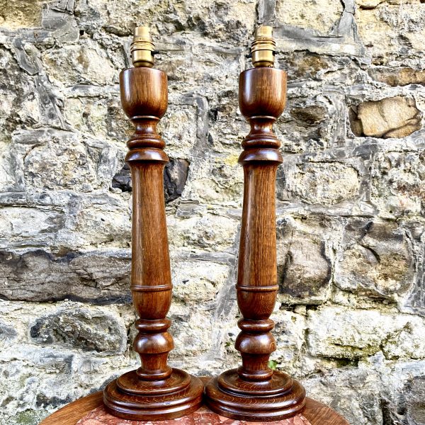 A Pair of Turned Oak Lamps
